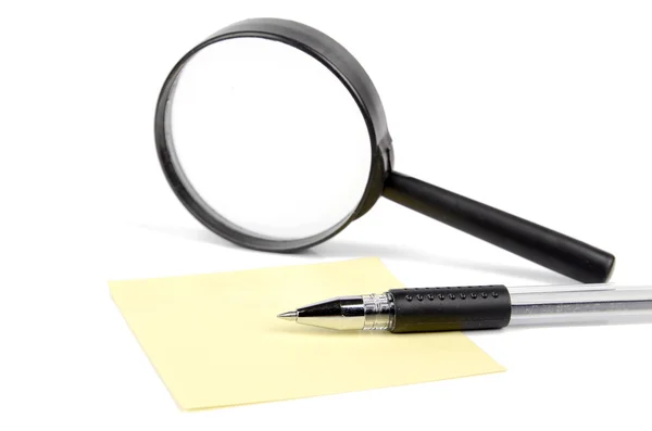 Magnifier,pen and notepaper — Stock Photo, Image