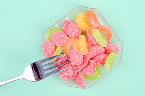 Sladké bonbony a vidlice — Stock fotografie