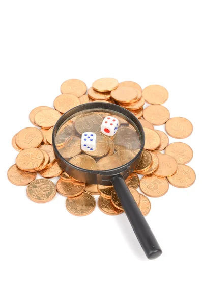 Dice and magnifier with coins — Stock Photo, Image