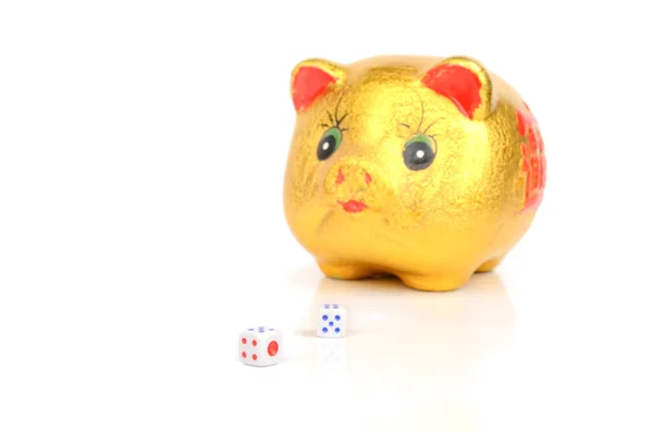 Piggy bank and dices — Stock Photo, Image