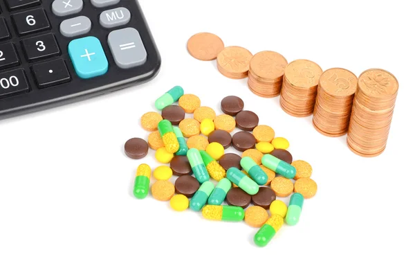 Медицина, монети і калькулятор — стокове фото