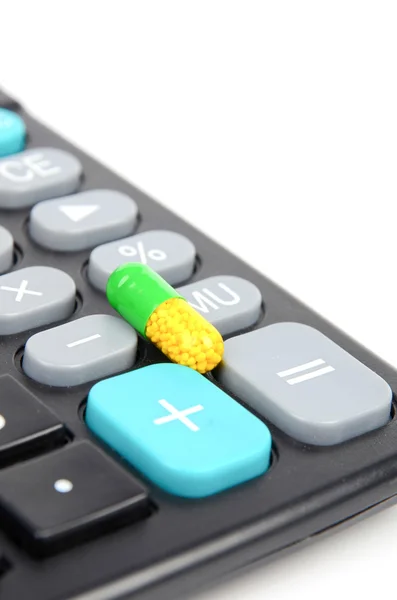 Geneeskunde en rekenmachine — Stockfoto