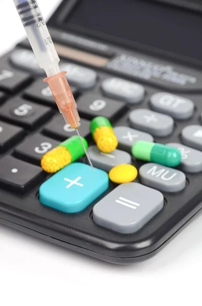 Geneeskunde en rekenmachine — Stockfoto