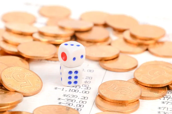 Coins and bank book with dices — Stock Photo, Image