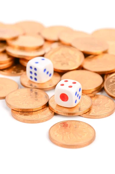 Coins and dices on white background — Stock Photo, Image