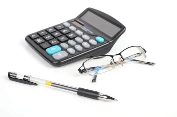 Miniräknare, penna och eye glasögon — Stockfoto