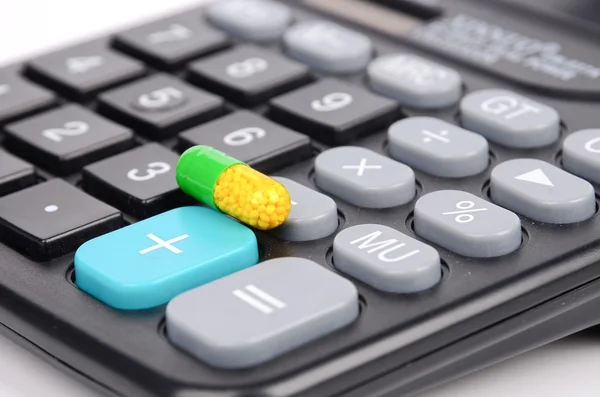 Medicine and calculator Stock Picture
