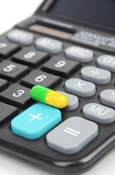 Medicine and calculator Stock Image