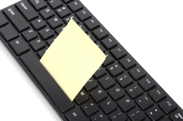 Computer keyboard and notepaper — Stock Photo, Image