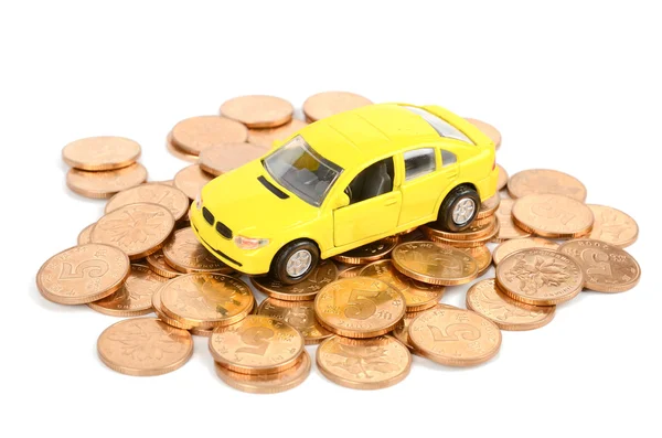 Žluté auto a mince — Stock fotografie