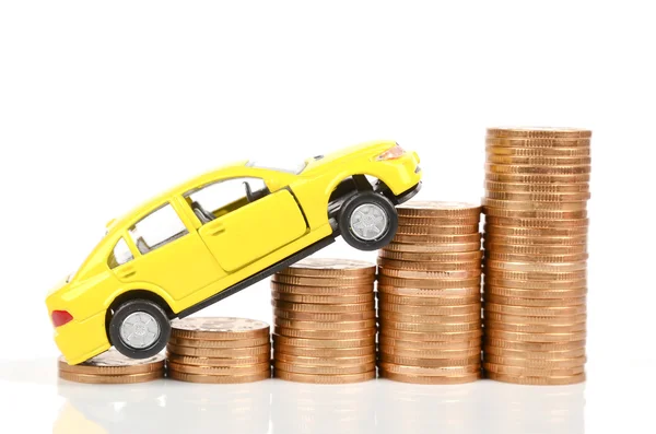 Yellow car and coins — Stock Photo, Image