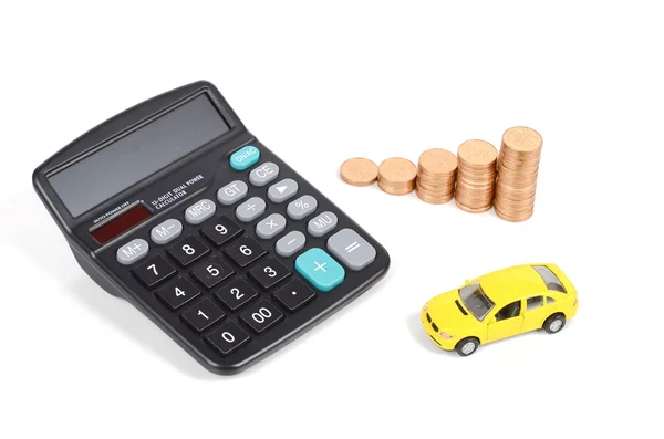 Kalkulačka, mince a hračka auto — Stock fotografie
