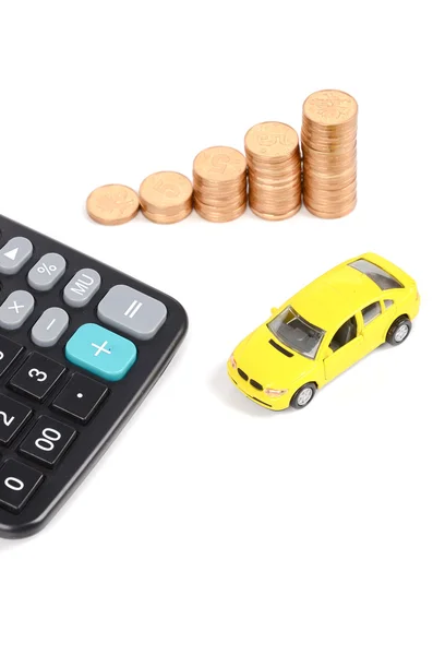 Calculadora, moedas e carro de brinquedo — Fotografia de Stock