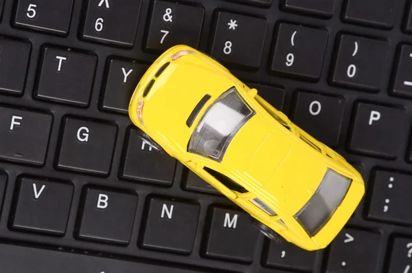 Toy car on keyboard — Stock Photo, Image