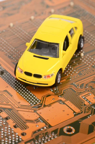Toy car and circuit board — Stock Photo, Image
