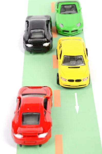 Carro de brinquedo na estrada — Fotografia de Stock