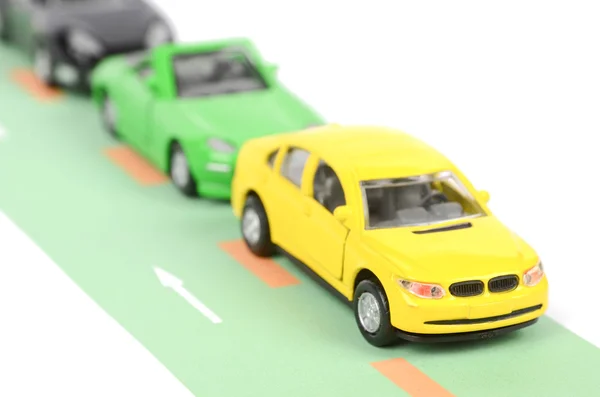 Speelgoedauto op weg — Stockfoto