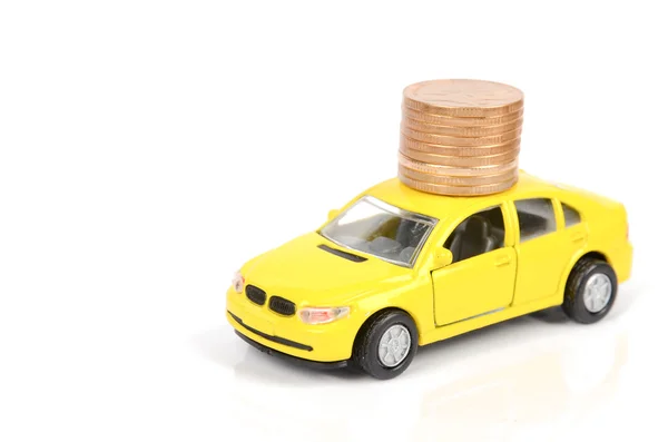 Speelgoedauto en munten — Stockfoto