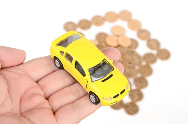 Spielzeugauto und Münzen — Stockfoto