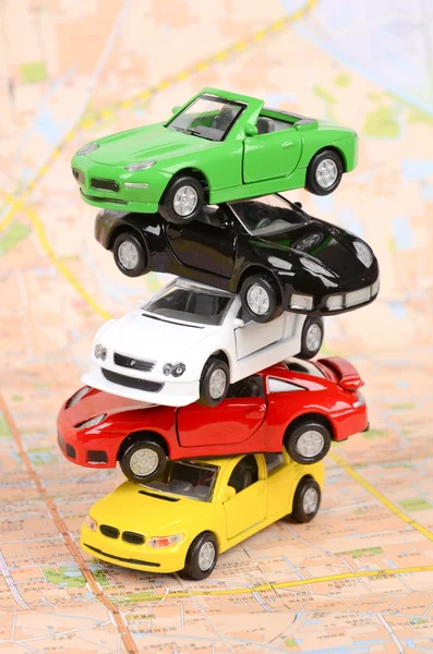 Toy cars on map — Stock Photo, Image