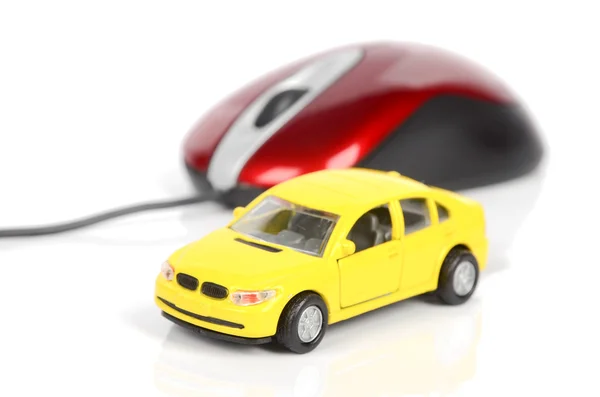 Іграшковий автомобіль і комп'ютерна миша — стокове фото