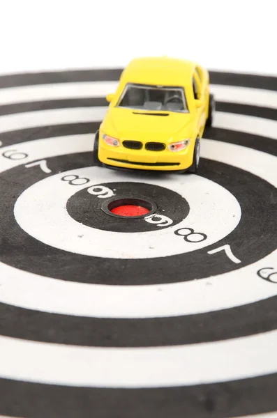 Toy car on dart board — Stock Photo, Image