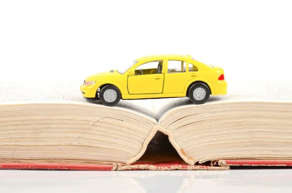 stock image Toy car and dictionary