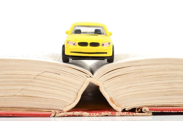 stock image Toy car and dictionary