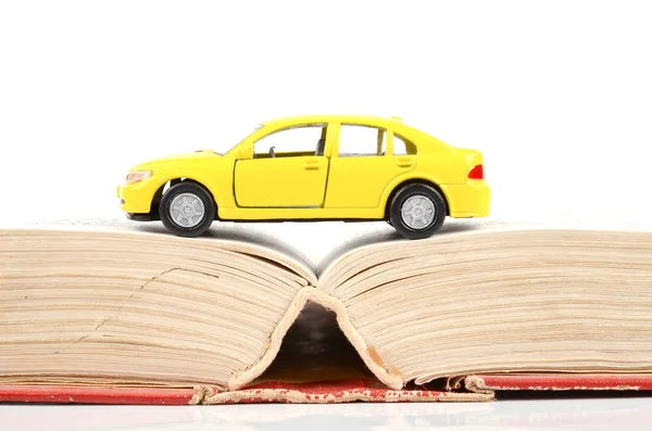 stock image Toy car and dictionary