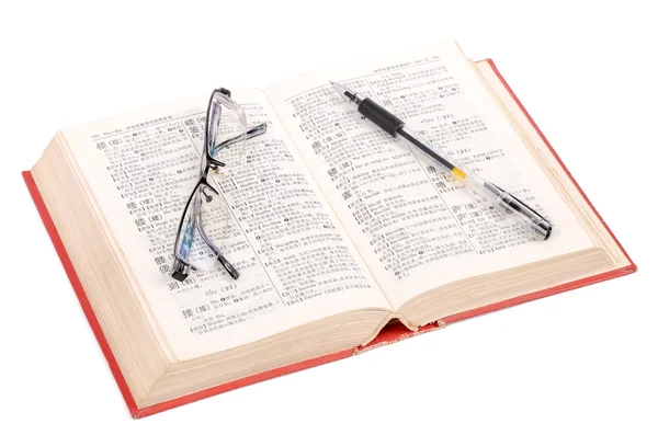 Caneta e óculos com livro — Fotografia de Stock