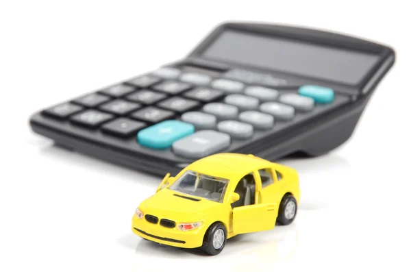 Carro de brinquedo e calculadora — Fotografia de Stock