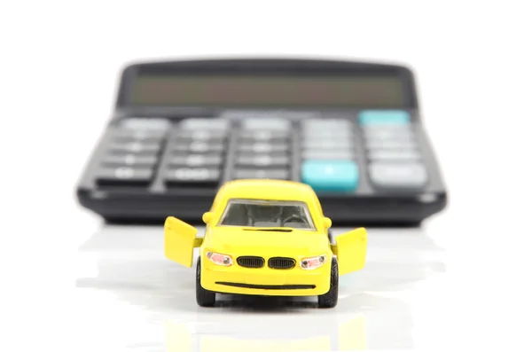 Speelgoedauto en rekenmachine — Stockfoto
