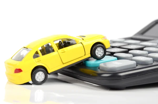 おもちゃの車と電卓 — ストック写真
