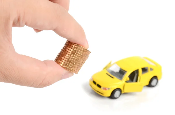 Іграшковий автомобіль і монета — стокове фото