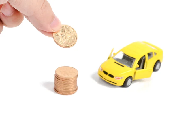 Іграшковий автомобіль і монета — стокове фото