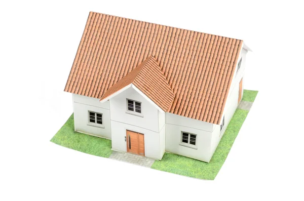 Model huis op witte achtergrond — Stockfoto