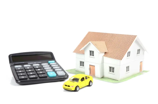 Toy car and house with calculator — Stock Photo, Image