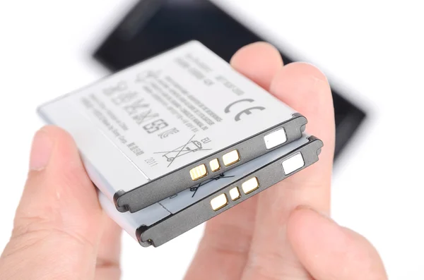 Batterij en cellphone — Stockfoto