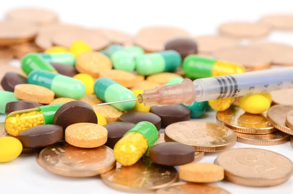 Medicine and coins — Stock Photo, Image