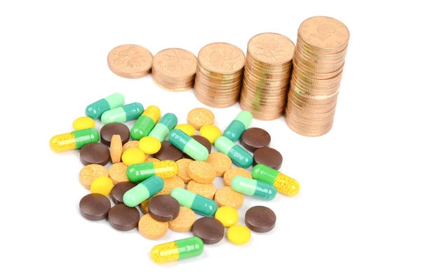 Монеты и лекарства — стоковое фото