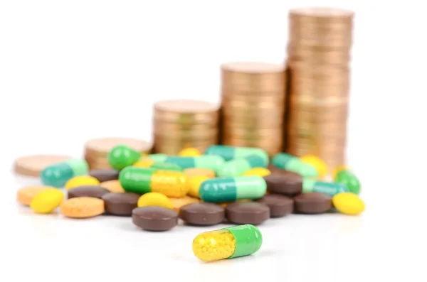 Монеты и лекарства — стоковое фото