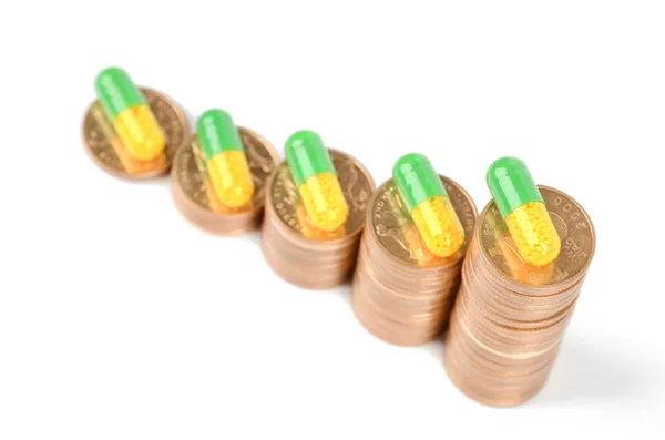 Coins and medicine — Stock Photo, Image