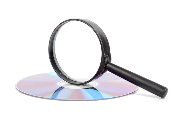 Magnifier glass and DVD — Stock Photo, Image