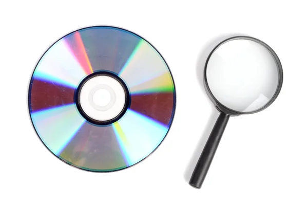 Stock image Magnifier glass and DVD