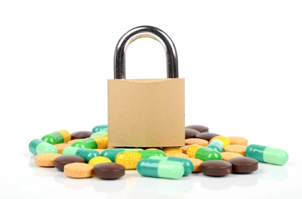 stock image Padlock and medicine on white background