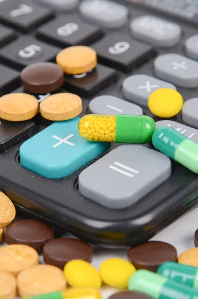 Medicine and calculator — Stock Photo, Image