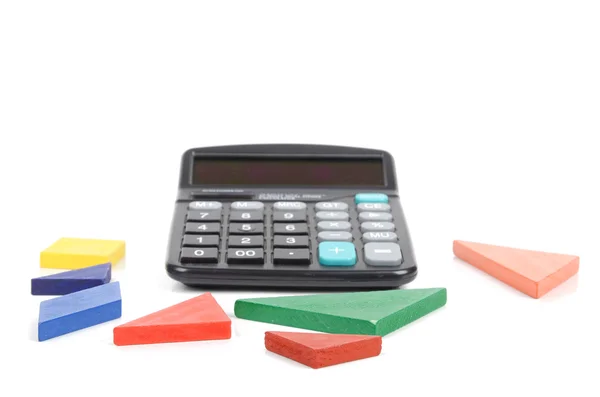 Tangram y calculadora sobre fondo blanco —  Fotos de Stock
