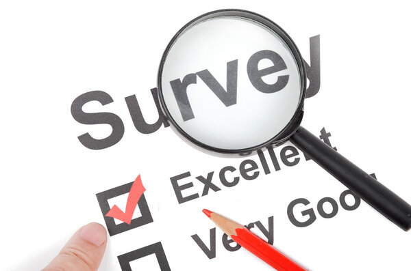 Magnifier and pencil on survey page