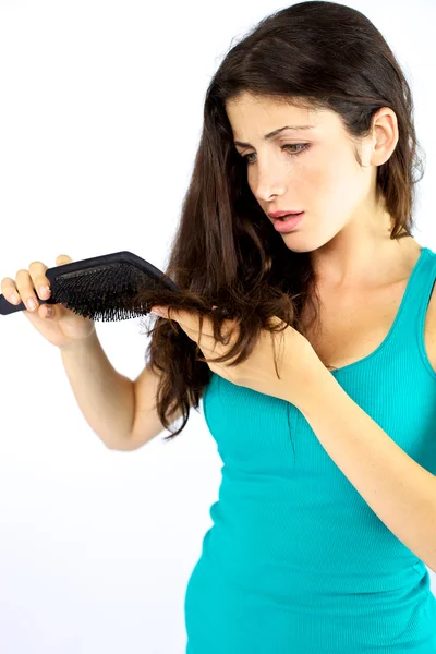 Beautiful woman unhappy about her long hair — Stock Photo, Image