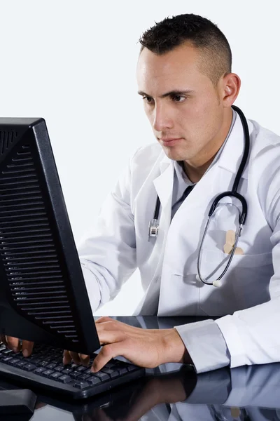 Male Doctor typing on computer — Stock Photo, Image